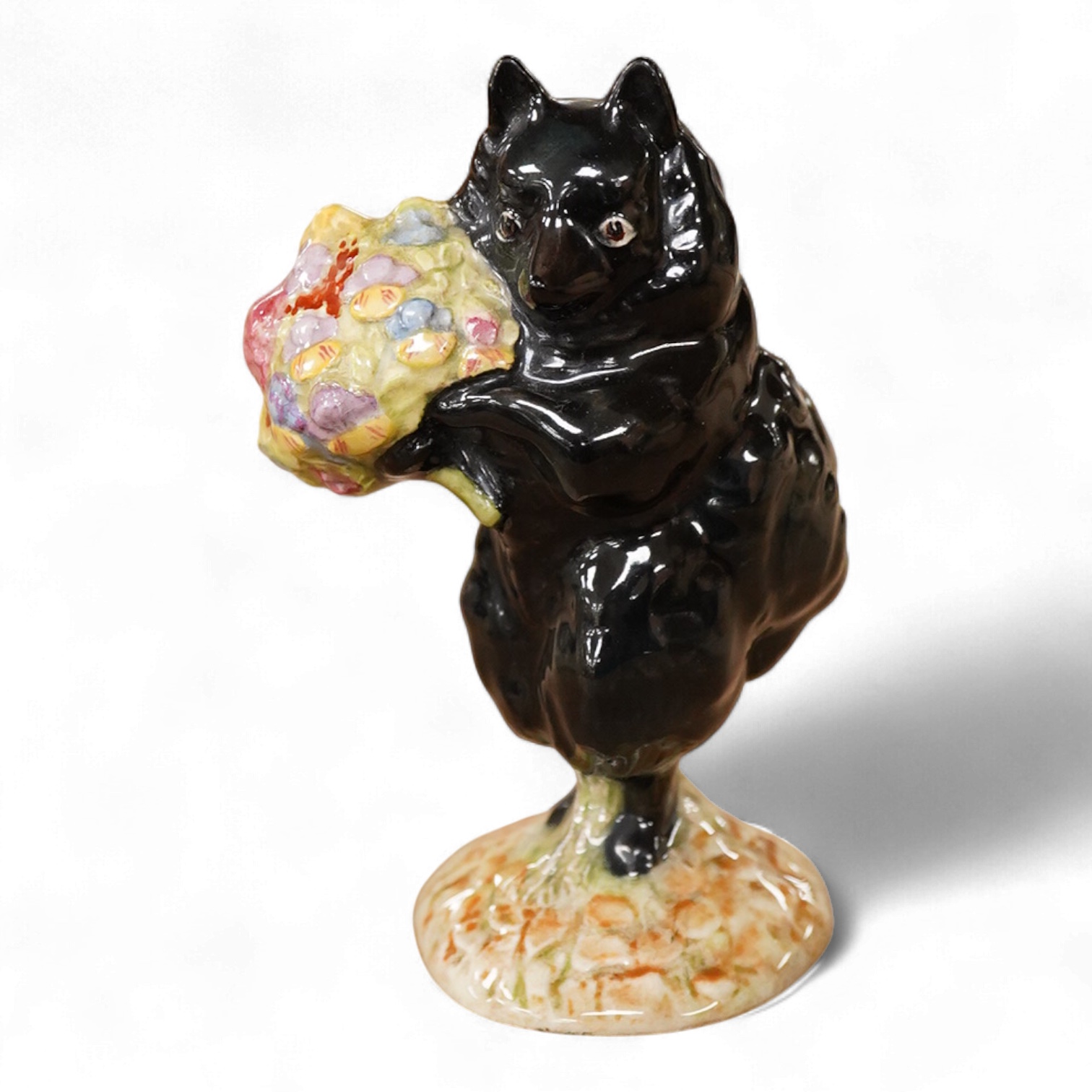 A Beatrix Potter F Warne and Co Ltd, Beswick figure of “Duchess” with flowers, gold stamp to base. 10cm high